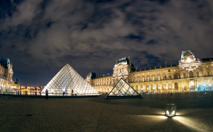 The Louvre museum at night in Paris